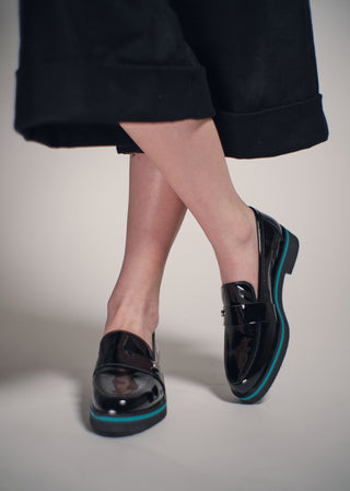 Copardo Maja black patent leather loafers worn on foot lifestyle view