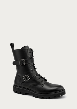Single black leather combat-style boot with buckle straps on a neutral background.