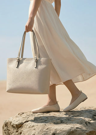 Veronica beige leather tote bag by Copardo in a warm desert setting, minimalist style